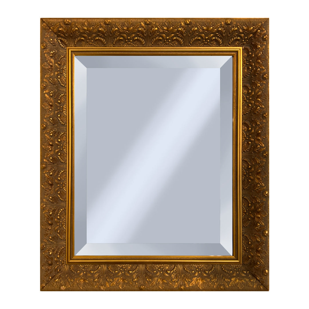 Decorative gold mirror with intricate floral patterns on a white background