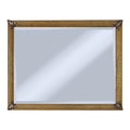 Gold-framed with hand embellished corners mirror on a white background