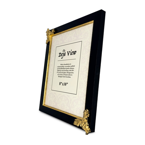Decorative picture frame with gold accents on a white background