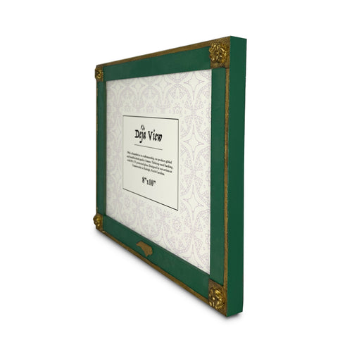 Green and gold picture frame with a decorative backing on a white background