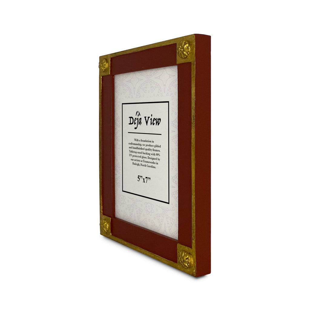 Wooden picture frame with gold accents on a white background