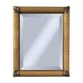Decorative mirror with silver corner decor on a gold frame on a white background