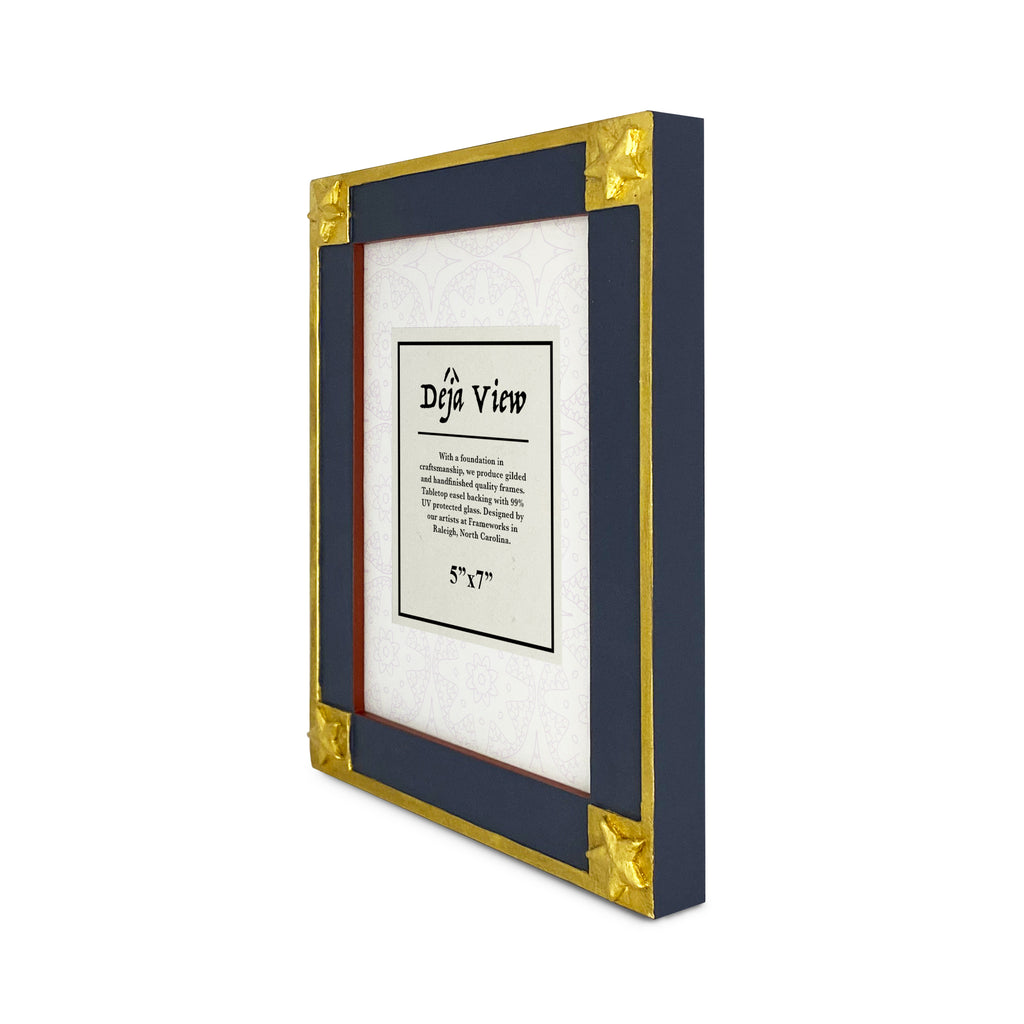 Decorative picture frame with gold and navy accents on a white background