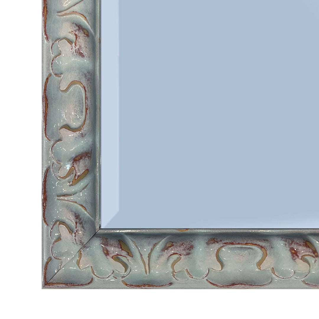 Corner detail of teal mirror on white back ground